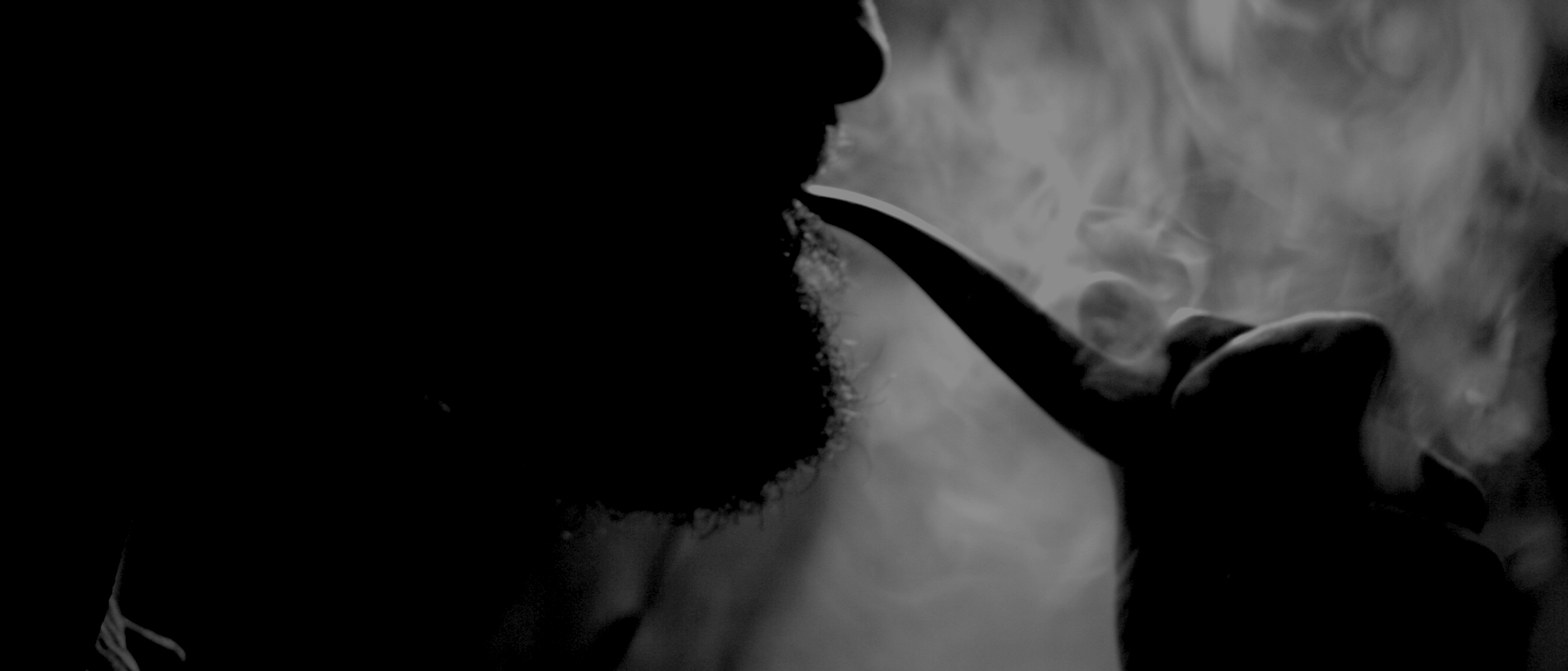 Man smoking pipe tobacco